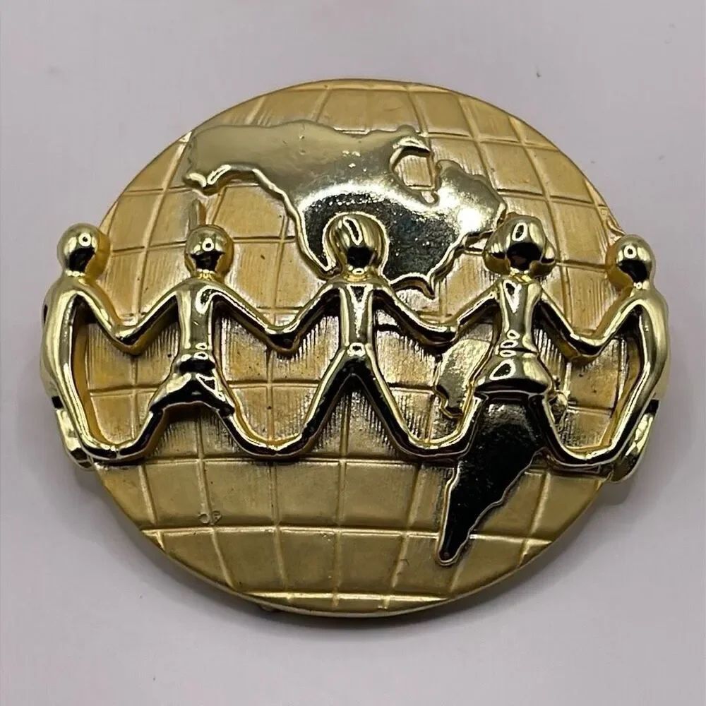 Signed AJC Globe Children Holding Hands Lapel Pin Brooch Goldtone Metal